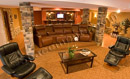 This finished basement in Phoenixville, PA is warmed up with custom stonework on the columns and walls.