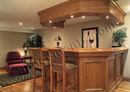 This custom wet bar in Delaware County, PA was built out of oak to match the homeowner's pool table.