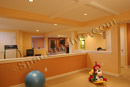 This finished basement in Montgomery County, PA has an exercise room that overlooks the children's playroom.