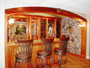 This finished basement project in Chester County, PA has a custom built wet bar with stone work.